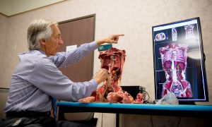 College of Dental Medicine Associate Dean for Simulation, Immersion, and Digital Learning Robert Hasel, DDS, demonstrates the new Anatomage Navigator in the J and K Virtual reality Learning Center at Western University of Health Sciences. WesternU is the first in the U.S. to test the Navigator. (Jeff Malet, WesternU)