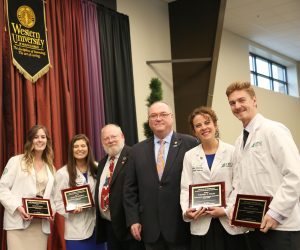 From left to right: J. Scott Heatherington, DO cholars Amanda G. Emmert and Nicole R. Scherlie; Dr. Rob Richardson, chairman of FamilyCare’s Board of Directors; Jeff Heatherington, LHD (Hon.), president and CEO of FamilyCare Family Plans; and Arthur O. Rott, DO scholars Whitney K. Wolfe and Philip M. Grenz,.