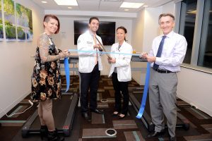 A ribbon-cutting ceremony was held Tuesday, Nov. 15, 2016 announcing that two treadmill desks are available to use for students, staff and faculty. The ceremony was held in HEC room No. 2042 where the two treadmill desks are housed. COMP student Karim Fahmy, middle left, and College of Dental Medicine student Diana Liao, middle right, championed getting the desks on campus in Pomona. To the far left is COMP media web specialist Crystal Rivera and far right is COMP Chair for the Department of Clinical Sciences Marcel Fraix, DO. (Jeff Malet, WesternU)