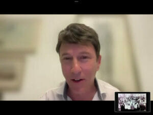 Screenshot of man speaking on Zoom.