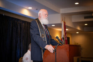 John Forbing at Podium