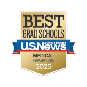 A gold and white badge reads “Best Grad Schools, U.S. News & World Report, Medical Primary Care 2026.”.